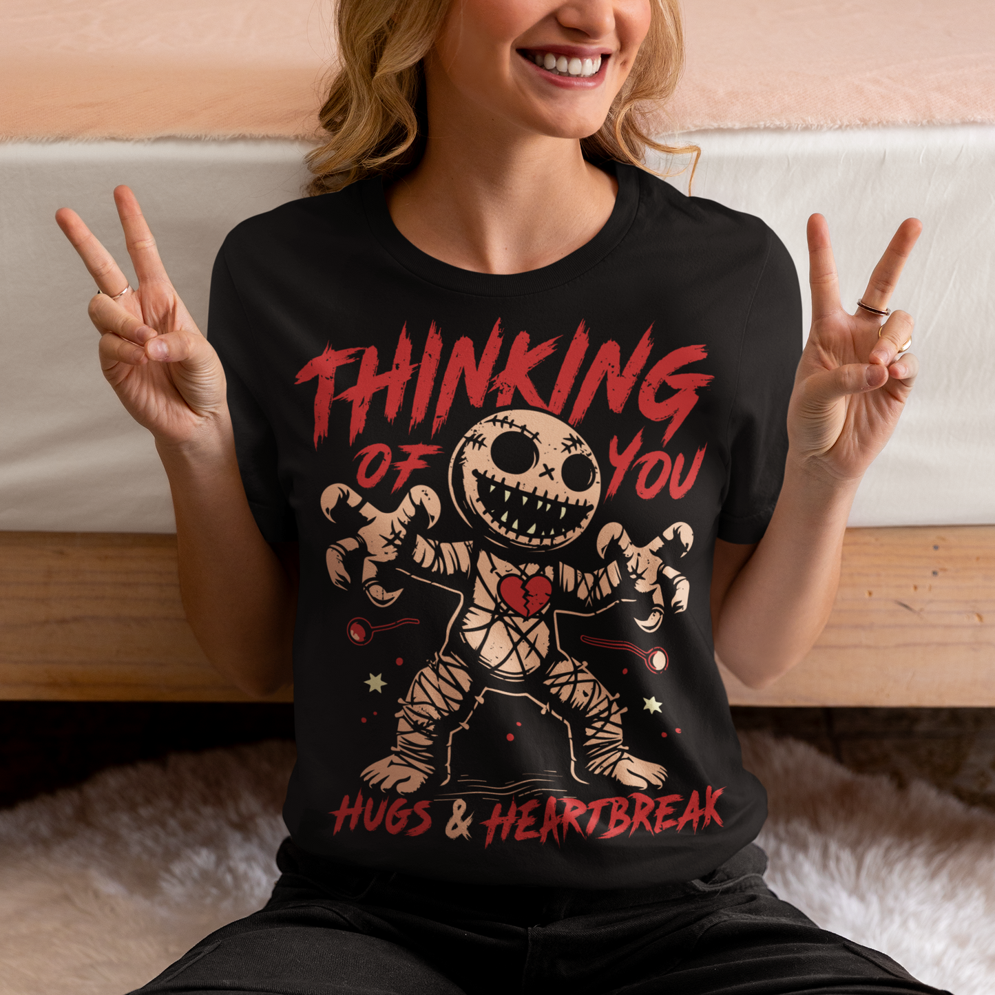 Dark humor meets twisted sweetness with this bold tee. Featuring a stitched-up voodoo doll at the center, the design captures that perfect mix of love and pain. Above the doll, the phrase “THINKING OF YOU” adds a playful sting, while below, “HUGS & HEARTBREAK” ties it all together with equal parts irony and affection. Perfect for anyone who loves edgy, alternative fashion—or just wants to send a cheeky message without saying a word.