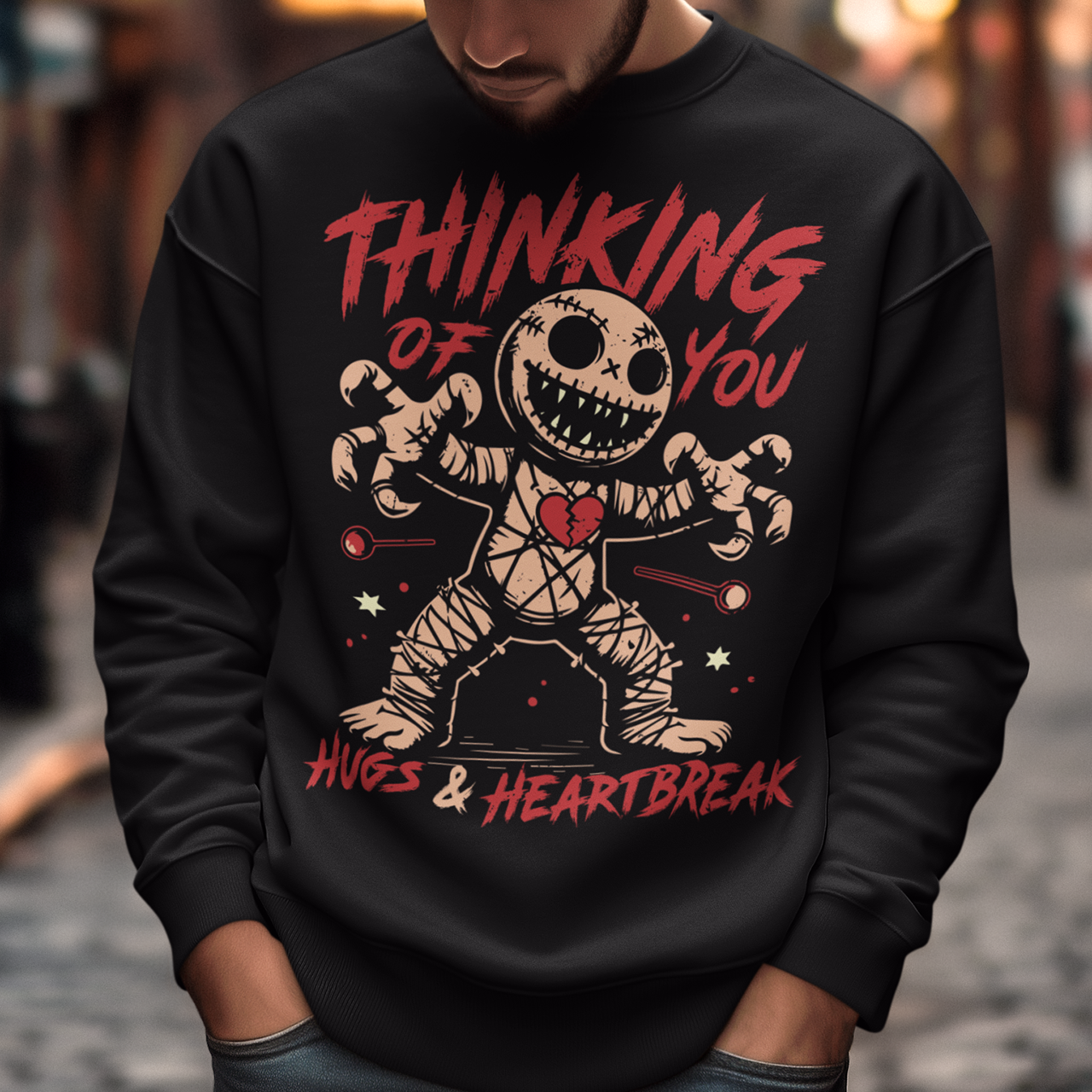 Dark humor meets twisted sweetness with this bold sweatshirt. Featuring a stitched-up voodoo doll at the center, the design captures that perfect mix of love and pain. Above the doll, the phrase “THINKING OF YOU” adds a playful sting, while below, “HUGS & HEARTBREAK” ties it all together with equal parts irony and affection. Perfect for anyone who loves edgy, alternative fashion—or just wants to send a cheeky message without saying a word.
