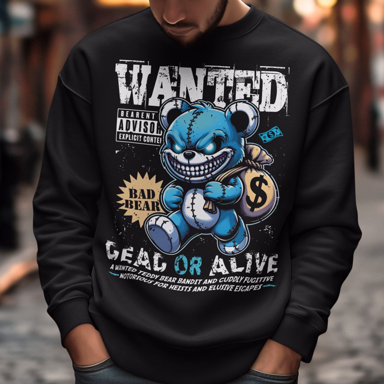 Turn heads with this bold and playful graphic sweatshirt featuring a mischievous teddy bear caught in the act! The design showcases a cartoon-style teddy bear sneaking away with a bag of money. Above the bear reads “WANTED”, while below it warns “DEAD OR ALIVE” giving it a vintage outlaw poster vibe with a fun, lighthearted twist.