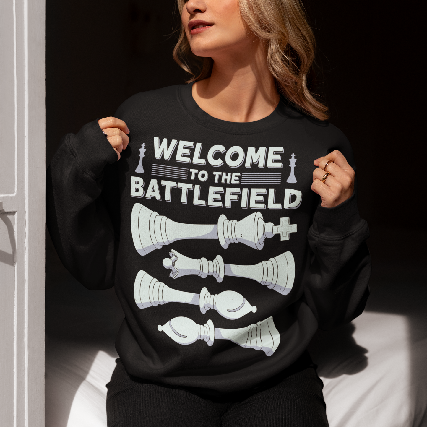 Step onto the board in style with this striking chess-themed t-shirt. Featuring four chess pieces boldly lined up across the chest, this design captures the power and elegance of the game. Above them, the phrase "WELCOME TO THE BATTLEFIELD" commands attention, setting the tone for every strategic thinker and competitor. Whether you're a seasoned grandmaster or just love the game, this shirt is your perfect uniform for everyday victories.