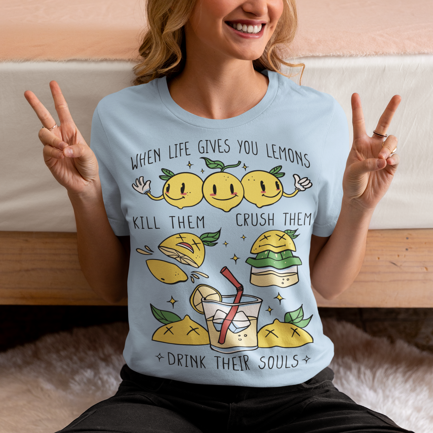 Introducing our adorable and quirky Lemonade-themed t-shirt that is sure to turn heads and bring a smile to your face! This shirt features a delightful design showcasing cute lemons being transformed into delicious lemonade, accompanied by the bold, tongue-in-cheek text: "WHEN LIFE GIVES YOU LEMONS, KILL THEM, CRUSH THEM AND DRINK THEIR SOULS."