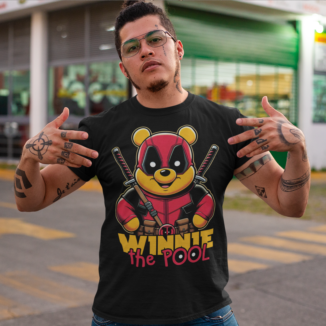 This t-shirt features a bold and playful design of Winnie the Pooh, reimagined as a tough, action-ready mercenary. Dressed in tactical gear, Pooh wields two crossed samurai swords on his back, giving him a fierce yet adorable warrior look. His expression is a mix of determination and charm, keeping the spirit of the beloved character alive, but with a thrilling twist.