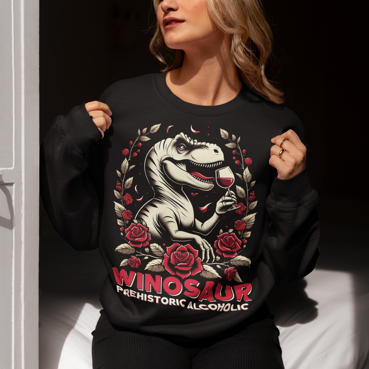 Introducing our "WINOSAUR" Sweatshirt, where prehistoric fun meets modern relaxation! This eye-catching design features a charming T-Rex delicately sipping a glass of wine, embodying the perfect blend of fierce and fabulous. Below this delightful scene, the text "WINOSAUR PREHISTORIC ALCOHOLIC" adds a playful twist, making it clear that even the mightiest of dinosaurs knew how to unwind. Ideal for wine lovers, dinosaur enthusiasts, and anyone who enjoys a good laugh.