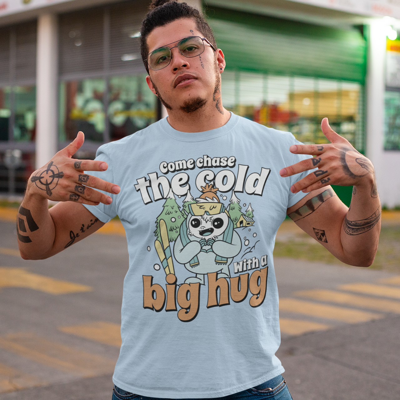 Hit the slopes in style with this playful Yeti Skiing t-shirt! Featuring a whimsical illustration of a friendly yeti standing in the snow, this design pairs perfectly with the cozy, heartwarming message: "Come chase the cold with a big hug." Whether you're a winter sports enthusiast or just love mythical creatures with a soft side, this tee wraps comfort, humor, and chill vibes into one awesome package.