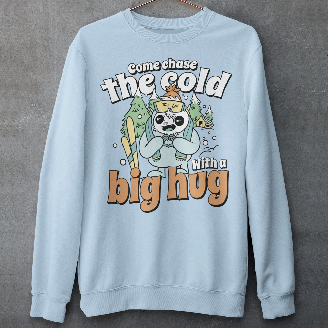 Hit the slopes in style with this playful Yeti Skiing sweatshirt! Featuring a whimsical illustration of a friendly yeti standing in the snow, this design pairs perfectly with the cozy, heartwarming message: "Come chase the cold with a big hug." Whether you're a winter sports enthusiast or just love mythical creatures with a soft side, this tee wraps comfort, humor, and chill vibes into one awesome package.