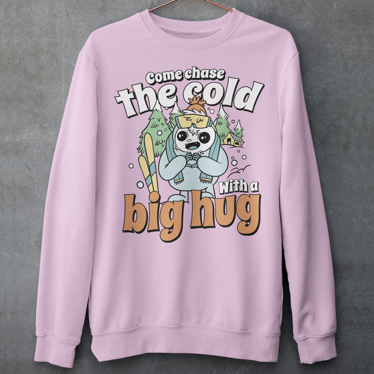 Hit the slopes in style with this playful Yeti Skiing sweatshirt! Featuring a whimsical illustration of a friendly yeti standing in the snow, this design pairs perfectly with the cozy, heartwarming message: "Come chase the cold with a big hug." Whether you're a winter sports enthusiast or just love mythical creatures with a soft side, this tee wraps comfort, humor, and chill vibes into one awesome package.