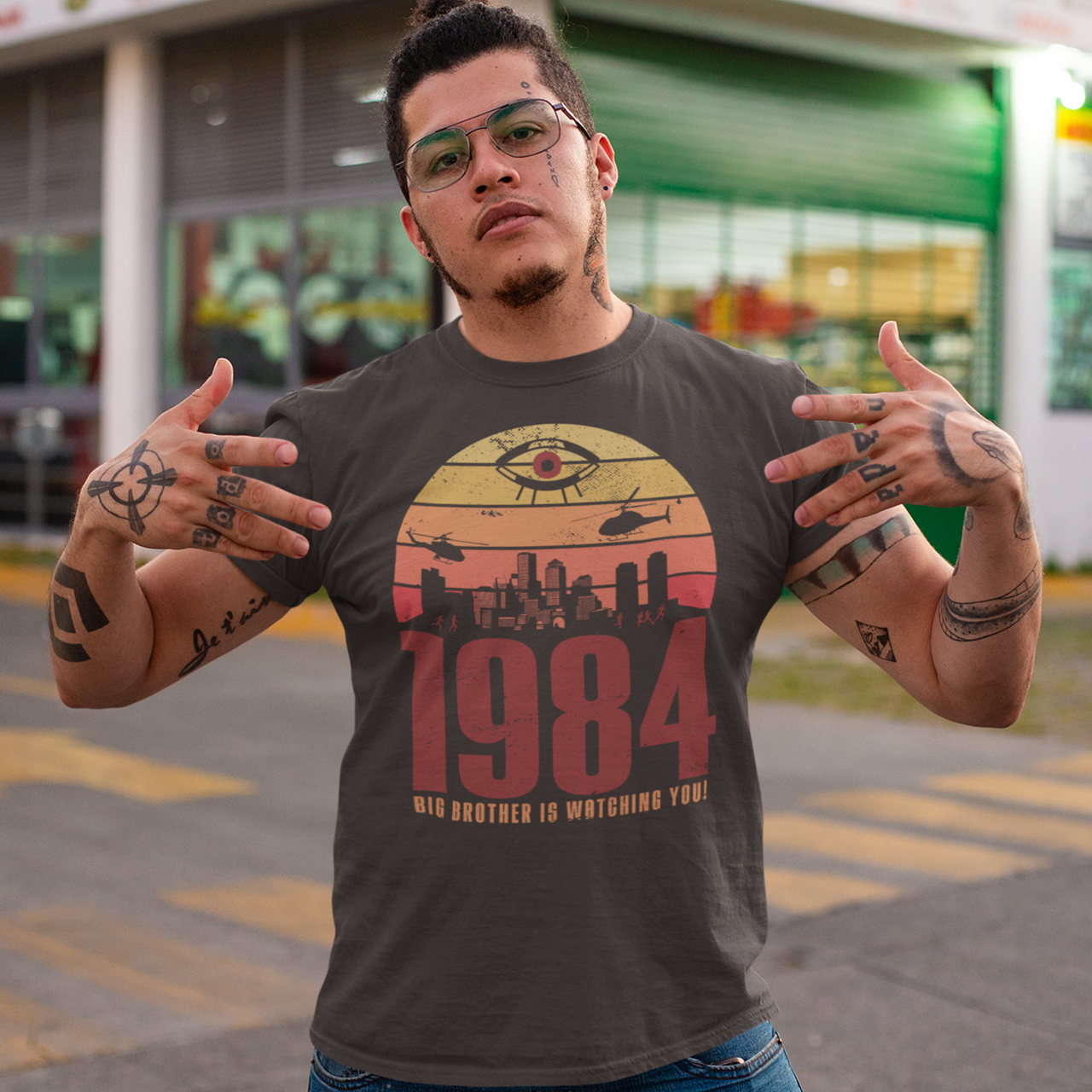 Introducing our George Orwell 1984 t-shirt with a bold "Big Brother is Watching" design! If you're a fan of Orwell's classic dystopian novel or just love thought-provoking literary references, this shirt is for you. The design features the iconic phrase "Big Brother is Watching" in small, bold letters, set against a stark sunset background. The lettering has a slightly distressed, vintage look, giving the shirt a cool, edgy vibe.