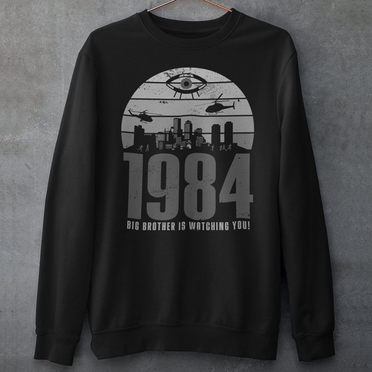 Black sweatshirt of a dystopian city silhouette on a retro sun with text 1984 BIG BROTHER IS WATCHING YOU!