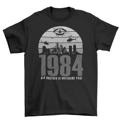 A black t-shirt with a design of a sunset with dystopian silhouette with text underneath "1984 BIG BROTHER IS WATCHING".