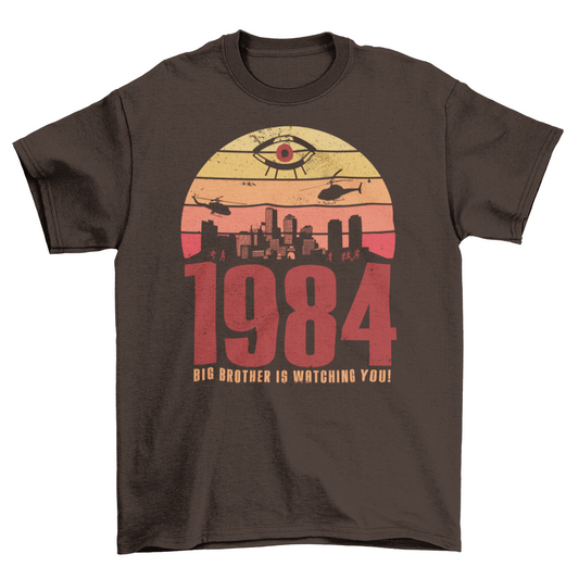 A brown t-shirt with a design of a sunset with dystopian silhouette with text underneath "1984 BIG BROTHER IS WATCHING".