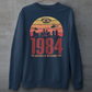 Navy sweatshirt of a dystopian city silhouette on a retro sun with text 1984 BIG BROTHER IS WATCHING YOU!