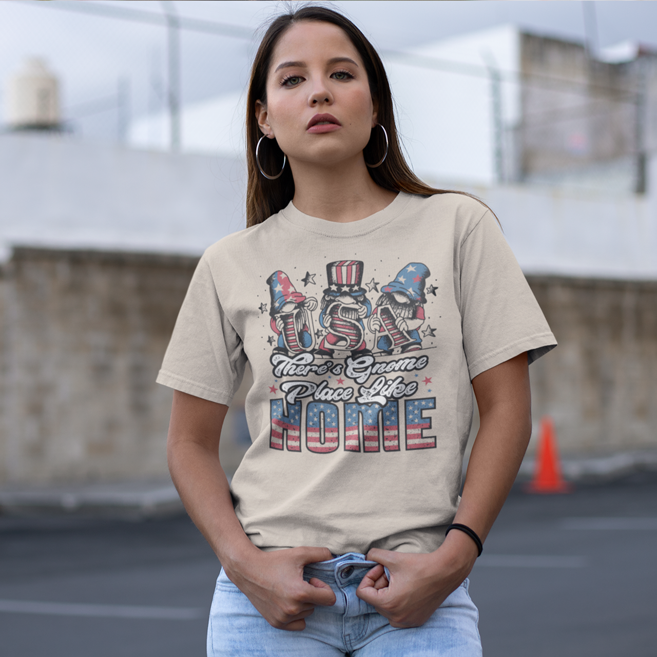 Cream t-shirt with 3 gnomes holding letters USA on the 4th of July with text "THERE'S GNOME PLACE LIKE HOME".