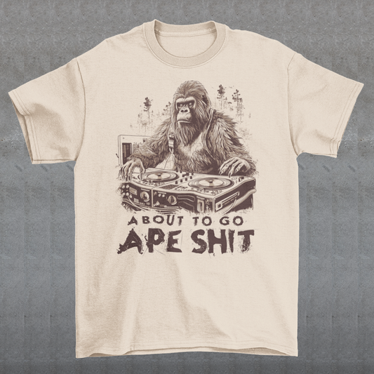 This t-shirt features a bold and eye-catching design of a gorilla playing turntables, surrounded by trees. The gorilla's intense expression and skilled DJing skills convey a sense of energy and excitement. The text "ABOUT TO GO Ape Shit" adds to the playful and humorous tone of the shirt, hinting at the wild and uninhibited fun that the wearer is ready to unleash. This phrase, combined with the gorilla DJ graphic, makes for a unique and memorable design that is sure to stand out in any crowd.