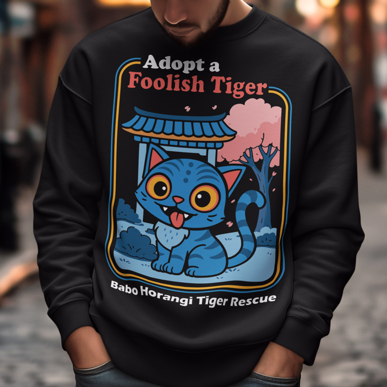 Adopt a foolish tiger t-shirt. Derpy kpop demon hunters shirt. Babo Horangi tee. This design feels like a Korean folklore creature wandered into a Saturday morning cartoon and decided to stay for snacks. A wide eyed blue “foolish tiger” sits under a temple gate with cherry blossoms drifting by, tongue out, zero survival instincts, maximum charm. The playful mix of myth inspired setting and goofy expression makes it equal parts legend and lovable disaster.on hunters shirt.