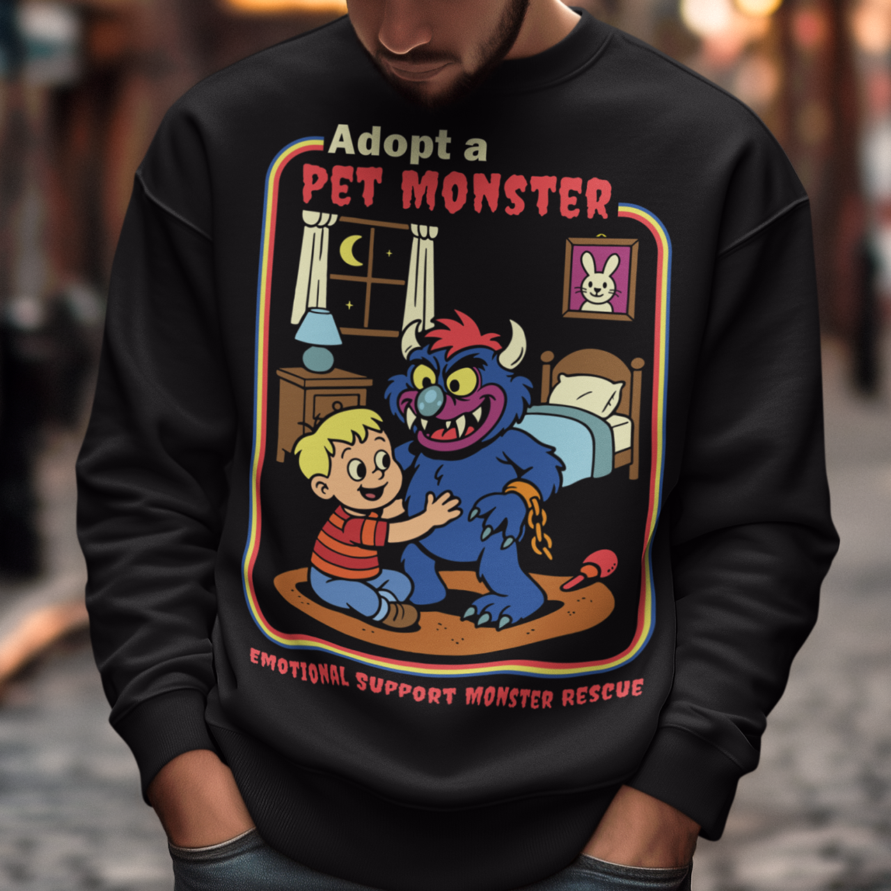 Soft, spooky, and suspiciously adorable, this sweatshirt looks like it came straight from a slightly haunted Saturday morning cartoon vault. The design features a wide eyed kid befriending a fuzzy little monster with tiny horns and big attitude, all set inside a cozy bedroom scene with retro storybook vibes. The bold “Adopt a Pet Monster” headline and “Emotional Support Monster Rescue” tagline sell the joke perfectly, blending cute chaos with feel good humor.