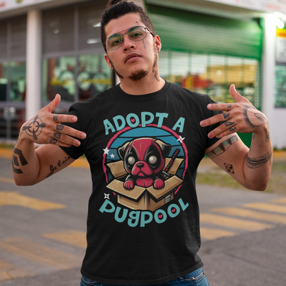 The T-shirt design features an adorable pug dressed as a mercenary, complete with a tiny red and black costume and a mask, sitting comfortably inside a slightly worn cardboard box. Around the design says "ADOPT A PUGPOOL" in a playful, hand-drawn font, giving it a quirky, homemade look.