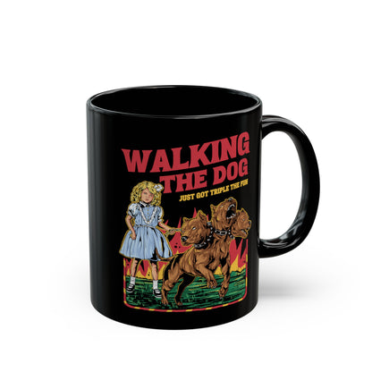 Black mug of a girl taking Cerberus dog for a walk with text WALKING THE DOG JUST GOT TRIPLE THE FUN.