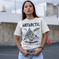 White t-shirt of an Alien wearing a jacket in Antarctica with a pyramid in the background and UFOs in the sky with text ANTARCTIC EXPEDITION.