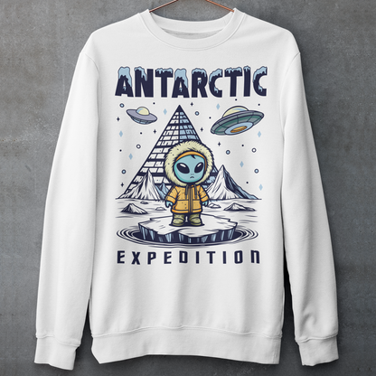 White sweatshirt of an Alien wearing a jacket in Antarctica with a pyramid in the background and UFOs in the sky with text ANTARCTIC EXPEDITION.