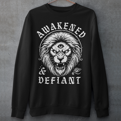 Unleash your inner power with this bold and striking sweatshirt featuring a fierce lion with a mystical third eye, symbolizing heightened awareness and untamed strength. The detailed artwork showcases the lion’s intense gaze, radiating wisdom and defiance, while the text "AWAKENED and DEFIANT" amplifies the message of resilience and enlightenment. This sweatshirt is perfect for those who stand fearless, awakened, and unapologetically themselves. Wear it and embrace the spirit of the untamed.