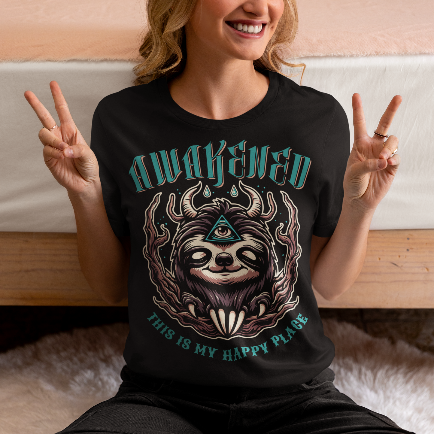 Black t-shirt of a sloth with a third eye with text above AWAKENED and text below THIS IS MY HAPPY PLACE.