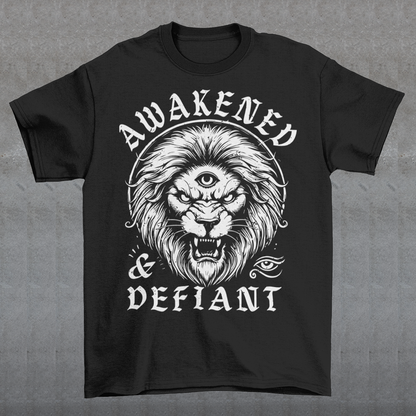 Unleash your inner power with this bold and striking t-shirt featuring a fierce lion with a mystical third eye, symbolizing heightened awareness and untamed strength. The detailed artwork showcases the lion’s intense gaze, radiating wisdom and defiance, while the text "AWAKENED &amp; DEFIANT" amplifies the message of resilience and enlightenment. This tee is perfect for those who stand fearless, awakened, and unapologetically themselves. Wear it and embrace the spirit of the untamed.
