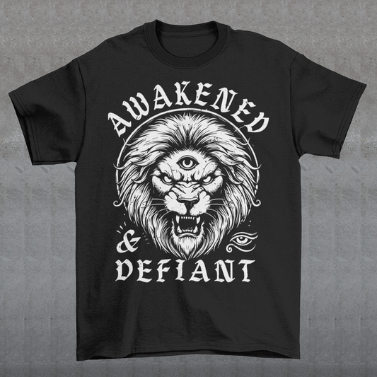 Unleash your inner power with this bold and striking t-shirt featuring a fierce lion with a mystical third eye, symbolizing heightened awareness and untamed strength. The detailed artwork showcases the lion’s intense gaze, radiating wisdom and defiance, while the text "AWAKENED &amp; DEFIANT" amplifies the message of resilience and enlightenment. This tee is perfect for those who stand fearless, awakened, and unapologetically themselves. Wear it and embrace the spirit of the untamed.