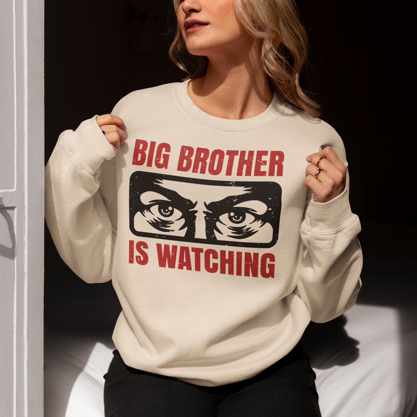 Cream sweatshirt with Big Brother Is Watching design.