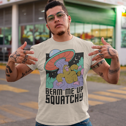 Introducing the extraterrestrial enigma that'll spark conversations and laughter wherever you go – the "BEAM ME UP SQUATCHY" t-shirt. This whimsical masterpiece seamlessly blends the worlds of cryptozoology and outer space, leaving a trail of intrigue and smiles in its wake. Set against a backdrop of midnight sky, this t-shirt showcases a captivating scene that defies conventional explanation.