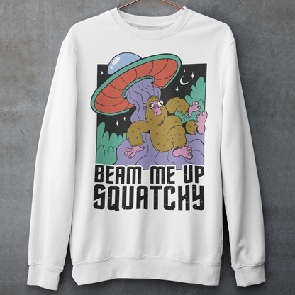 Introducing the extraterrestrial enigma that'll spark conversations and laughter wherever you go – the "BEAM ME UP SQUATCHY" sweatshirt. This whimsical masterpiece seamlessly blends the worlds of cryptozoology and outer space, leaving a trail of intrigue and smiles in its wake. Set against a backdrop of midnight sky, this sweatshirt showcases a captivating scene that defies conventional explanation.