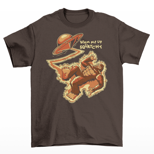 Brown t-shirt featuring a Sasquatch being abducted by a UFO with text "BEAM ME UP SQUATCHY".