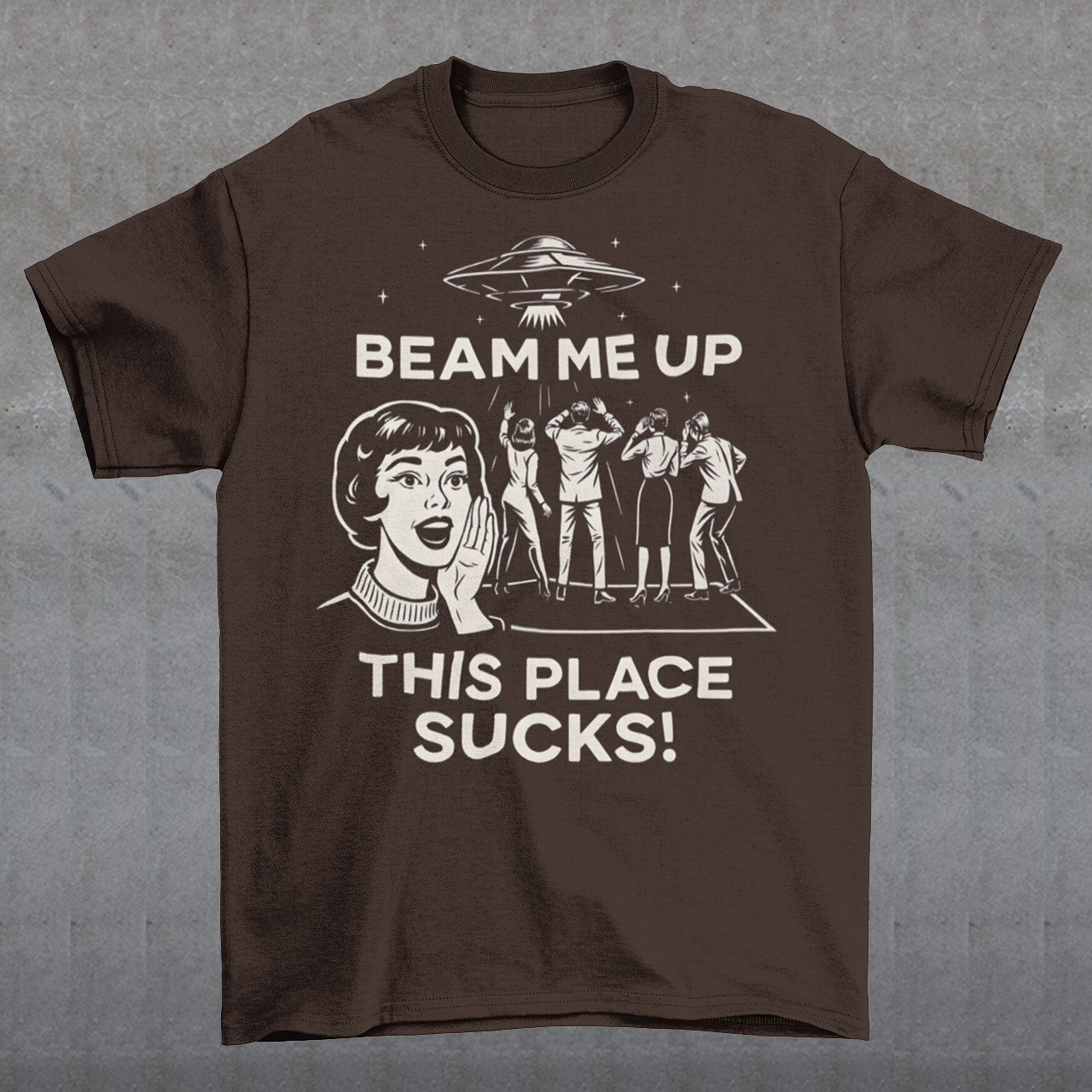This snark-powered retro UFO t-shirt brings the perfect escape fantasy to life. A vintage-style flying saucer hovers above a crowd while a wide-eyed woman rallies for interstellar rescue, paired with the bold line “Beam Me Up, This Place Sucks!” The design has a classic pulp-sci-fi look that feels like it tumbled out of an old comic rack. Ideal for anyone who survives their days with eye rolls, cosmic daydreams, and a desire to be anywhere else in the galaxy.