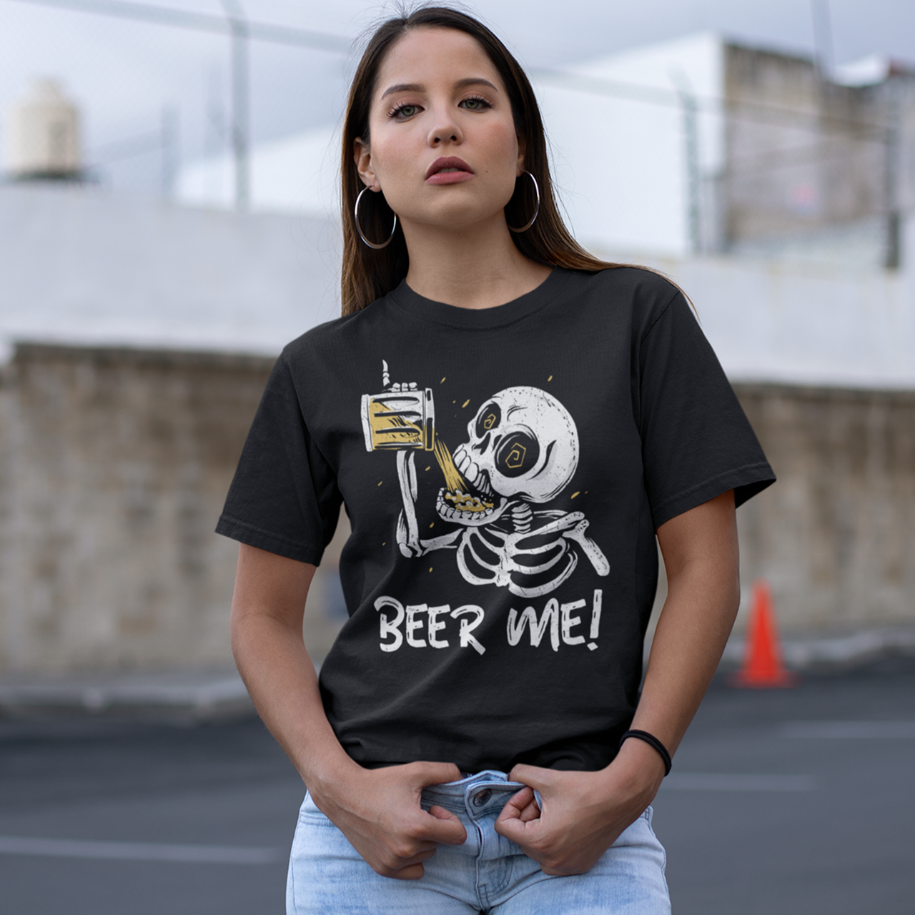 Black t-shirt of a skeleton drinking a beer with text underneath "BEER ME!"