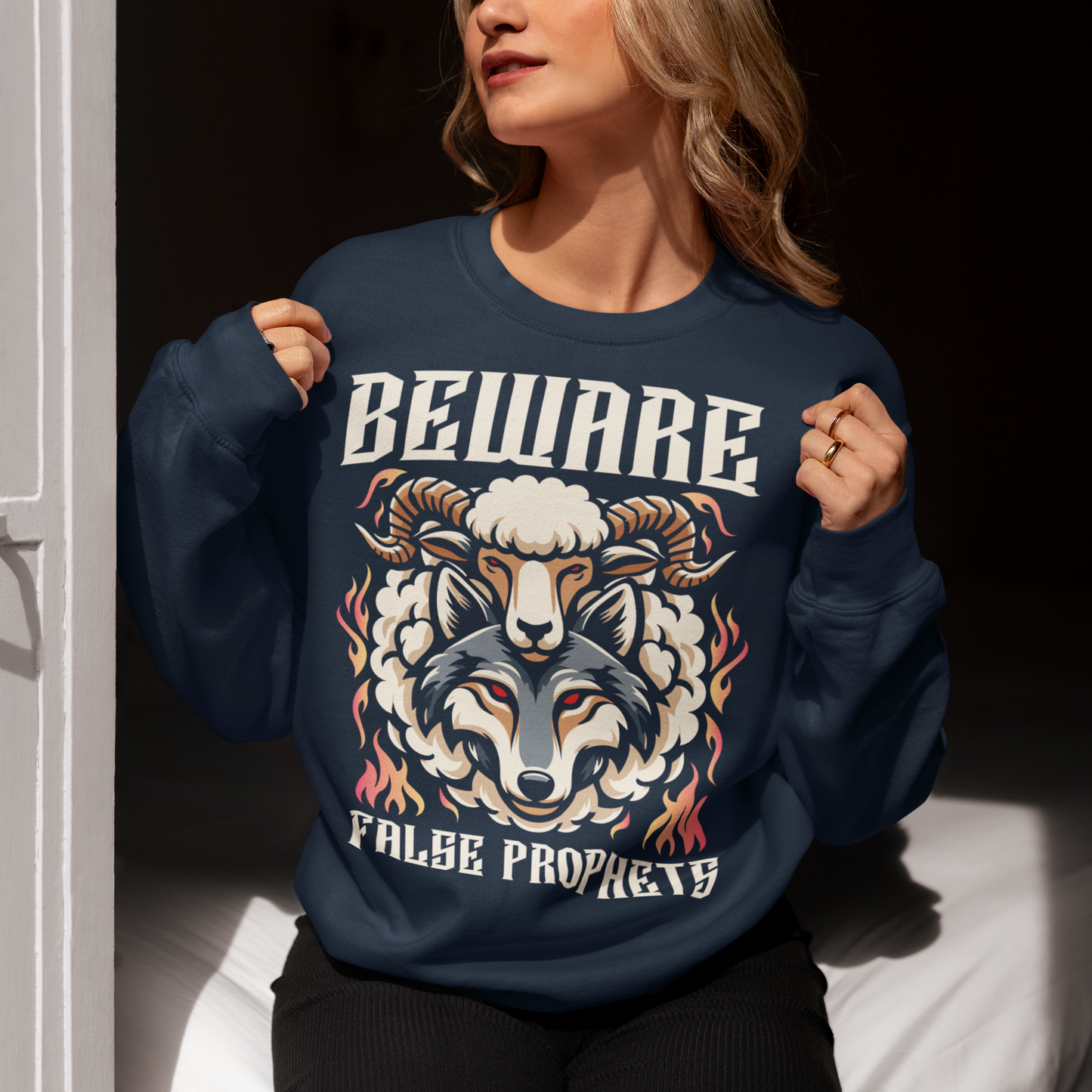 Navy Sweatshirt of a wolf in sheep's clothing with text BEWARE FALSE PROPHETS.