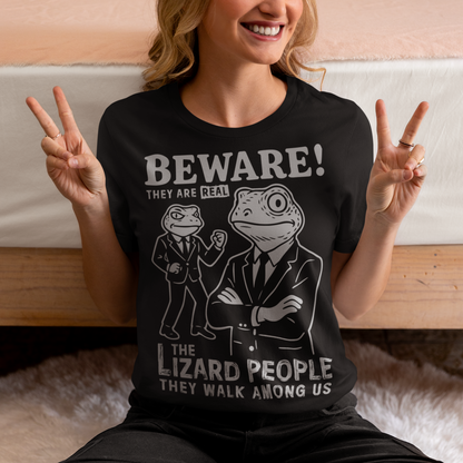 This “Beware! Lizard People” tee turns a classic conspiracy wink into wearable humor. The suited-up reptilian characters strike a bold, comic-book stance that adds a playful sense of intrigue to your outfit. Crisp line art and a vintage poster feel make it a standout for sci-fi lovers, meme collectors, and anyone who enjoys a touch of tongue-in-cheek absurdity. It’s the perfect shirt for sparking conversations and raising eyebrows in all the right ways.
