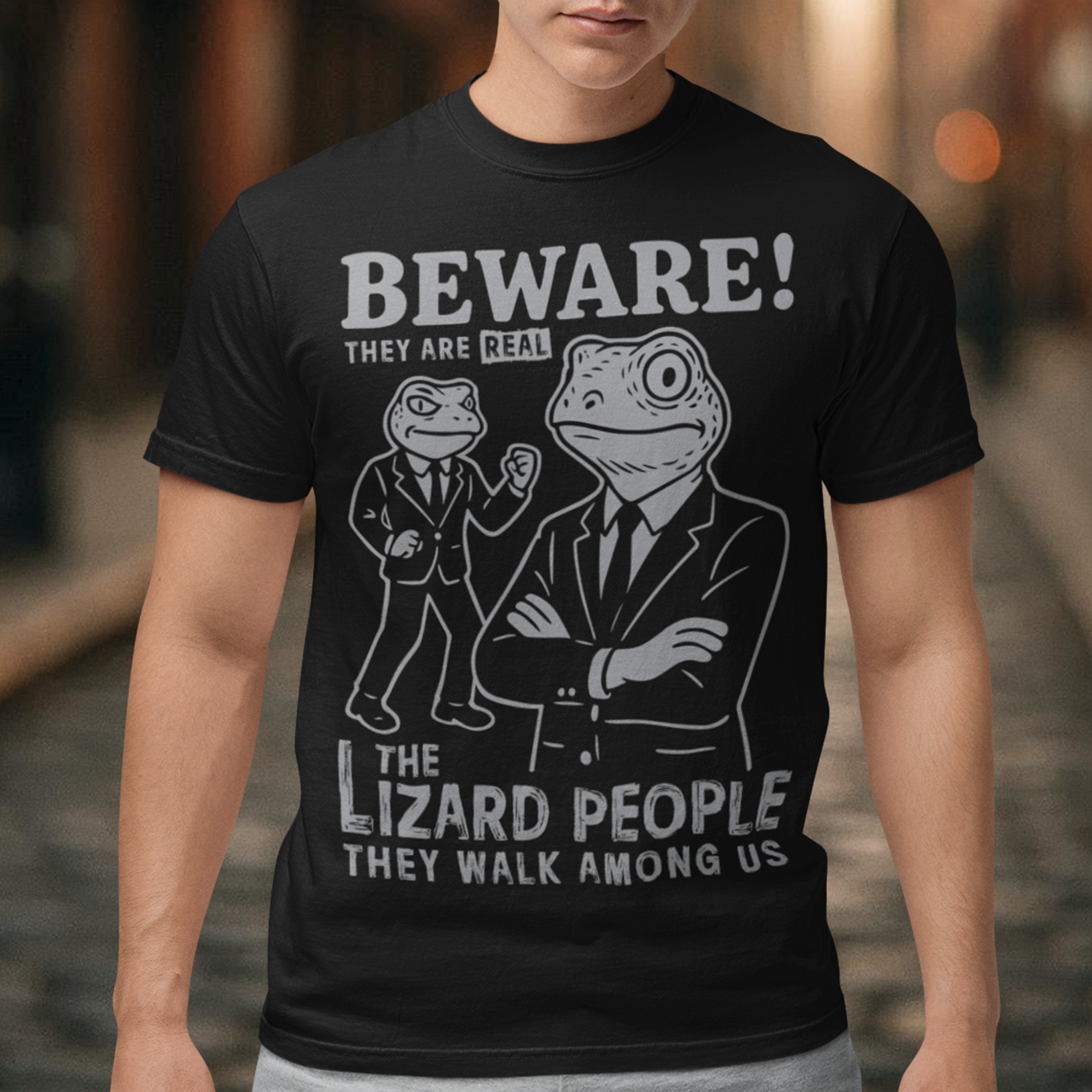 This “Beware! Lizard People” tee turns a classic conspiracy wink into wearable humor. The suited-up reptilian characters strike a bold, comic-book stance that adds a playful sense of intrigue to your outfit. Crisp line art and a vintage poster feel make it a standout for sci-fi lovers, meme collectors, and anyone who enjoys a touch of tongue-in-cheek absurdity. It’s the perfect shirt for sparking conversations and raising eyebrows in all the right ways.