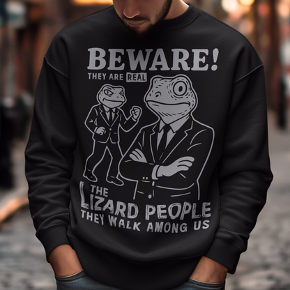 This “Beware! Lizard People” sweatshirt turns a classic conspiracy wink into wearable humor. The suited-up reptilian characters strike a bold, comic-book stance that adds a playful sense of intrigue to your outfit. Crisp line art and a vintage poster feel make it a standout for sci-fi lovers, meme collectors, and anyone who enjoys a touch of tongue-in-cheek absurdity. It’s the perfect shirt for sparking conversations and raising eyebrows in all the right ways.
