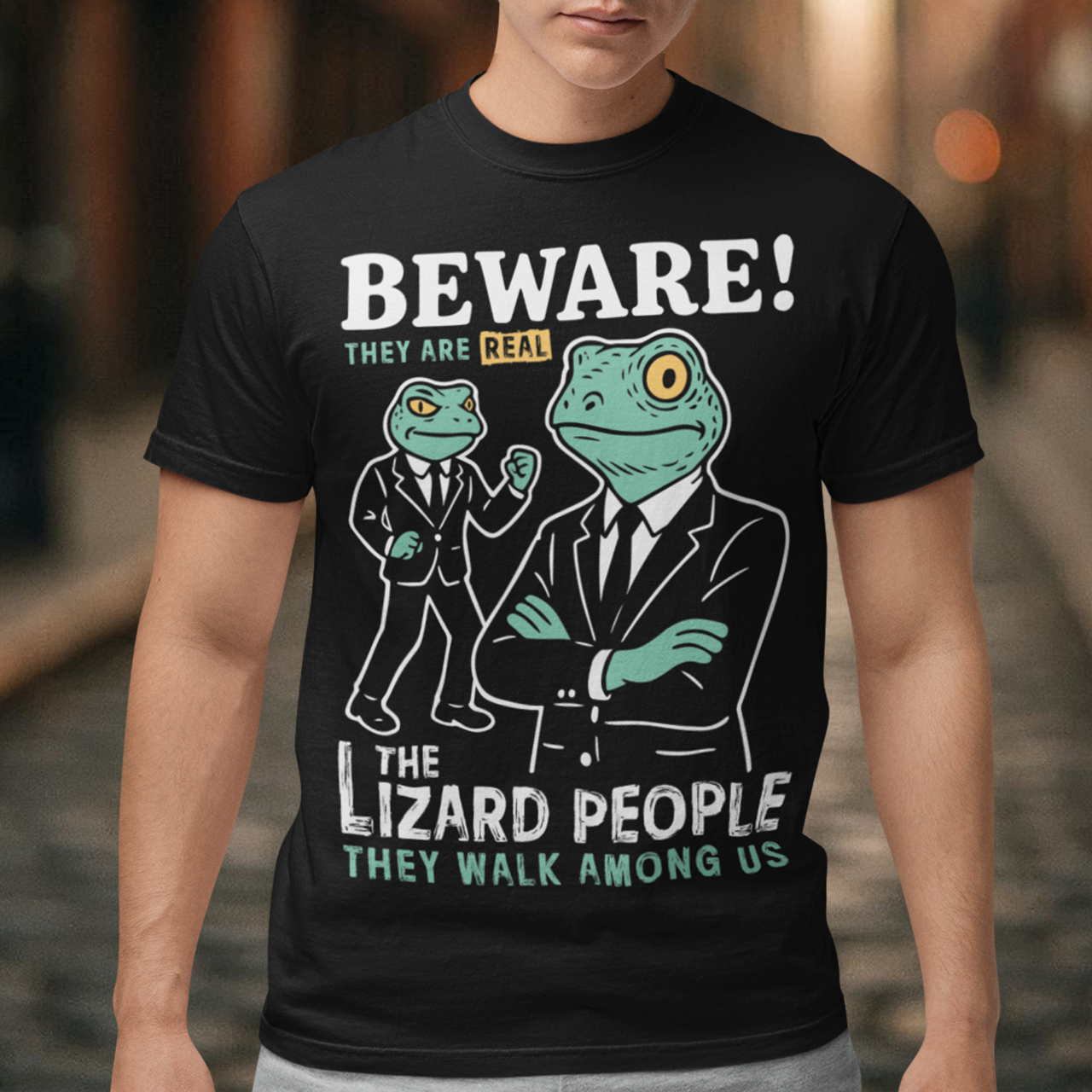 This “Beware! Lizard People” tee turns a classic conspiracy wink into wearable humor. The suited-up reptilian characters strike a bold, comic-book stance that adds a playful sense of intrigue to your outfit. Crisp line art and a vintage poster feel make it a standout for sci-fi lovers, meme collectors, and anyone who enjoys a touch of tongue-in-cheek absurdity. It’s the perfect shirt for sparking conversations and raising eyebrows in all the right ways.