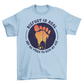 Light blue t-shirt with a bigfoot silhouette on a sunset foot with text "BIGFOOT IS REAL AND HE TRIED TO KICK MY ASS".