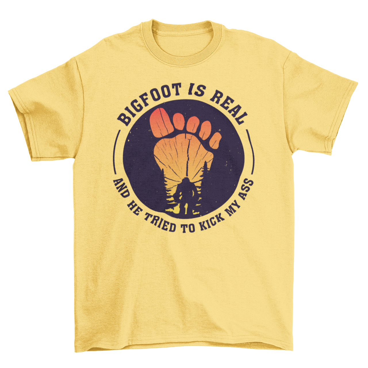 Yellow t-shirt with a bigfoot silhouette on a sunset foot with text "BIGFOOT IS REAL AND HE TRIED TO KICK MY ASS".