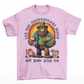 St Patrick's Day pink t-shirt of a Bigfoot dressed as a leprechaun holding a beer and a pot of gold with text above LET THE SHENANIGANS BEGIN.