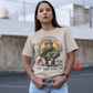 St Patrick's Day cream t-shirt of a Bigfoot dressed as a leprechaun holding a beer and a pot of gold with text above LET THE SHENANIGANS BEGIN.