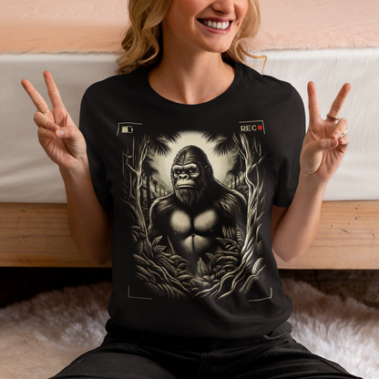 This t-shirt features a captivating and mysterious scene: Bigfoot, the legendary creature of folklore, is depicted peeking through dense, shadowy trees. The design captures the thrill of a rare sighting with intricate details, from the leaves rustling in the breeze to Bigfoot's curious expression.