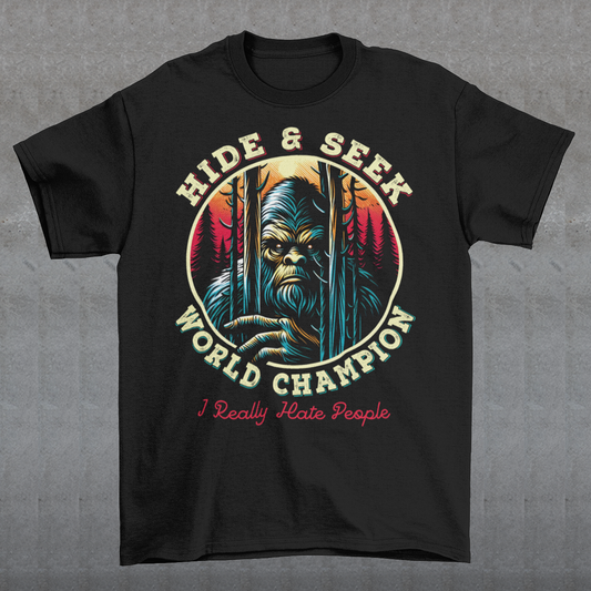 Unleash your playful side with our exclusive "Hide and Seek World Champion" t-shirt! This unique sweatshirt features an artistic rendition of Bigfoot peeking through a dense forest of towering trees. With a mischievous glint in his eyes, the legendary creature embodies the ultimate master of hide and seek. The bold, vintage-style text reads "HIDE and SEEK WORLD CHAMPION," celebrating Bigfoot's elusive charm.