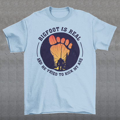 Step into the world of mysterious legends and untamed wilderness with our captivating t-shirt design featuring the legendary creature himself: Bigfoot. Against a breathtaking sunset backdrop, this design encapsulates the thrilling encounter between man and myth. At the center of the design, a striking depiction of Bigfoot takes the spotlight, his towering figure emerging from the dense forest the creature's shaggy fur and muscular frame evoke an air of primal strength and enigma.