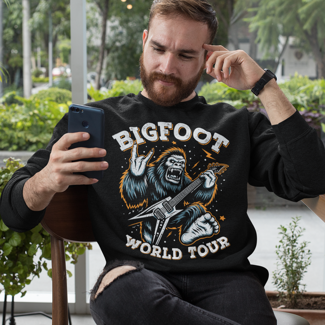 Black sweatshirt of Bigfoot playing an electric guitar with text BIGFOOT WORLD TOUR.