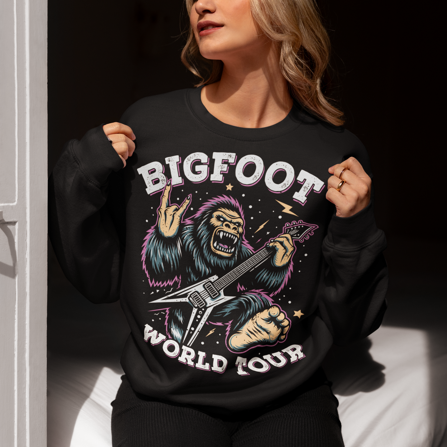 Black sweatshirt of Bigfoot playing an electric guitar with text BIGFOOT WORLD TOUR.