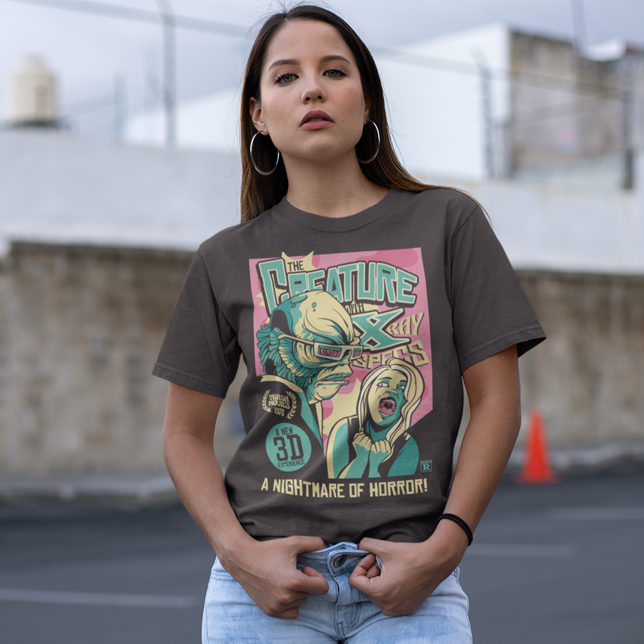 Brown t-shirt with comic book style design of the creature from the black lagoon.