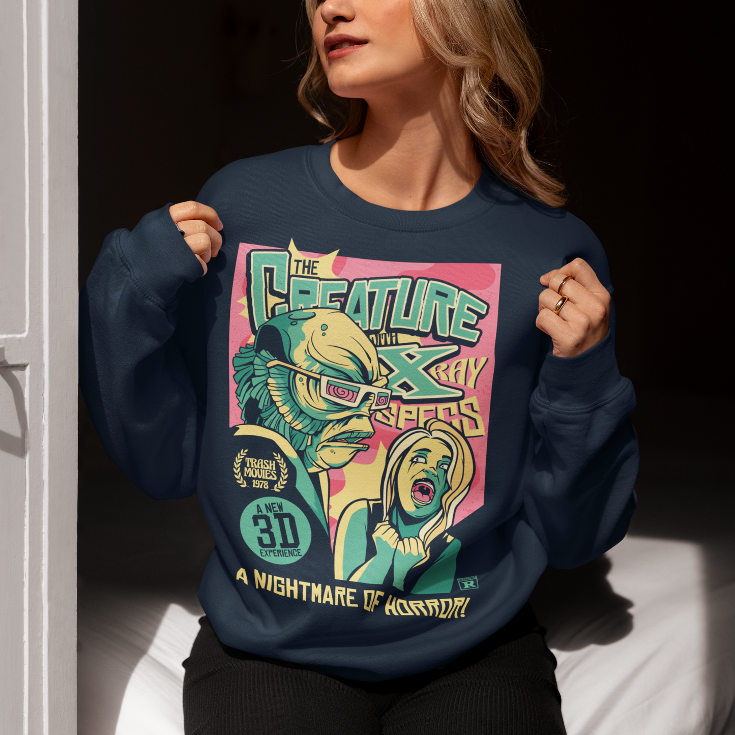 Navy sweatshirt of the creature of the black lagoon comic book.