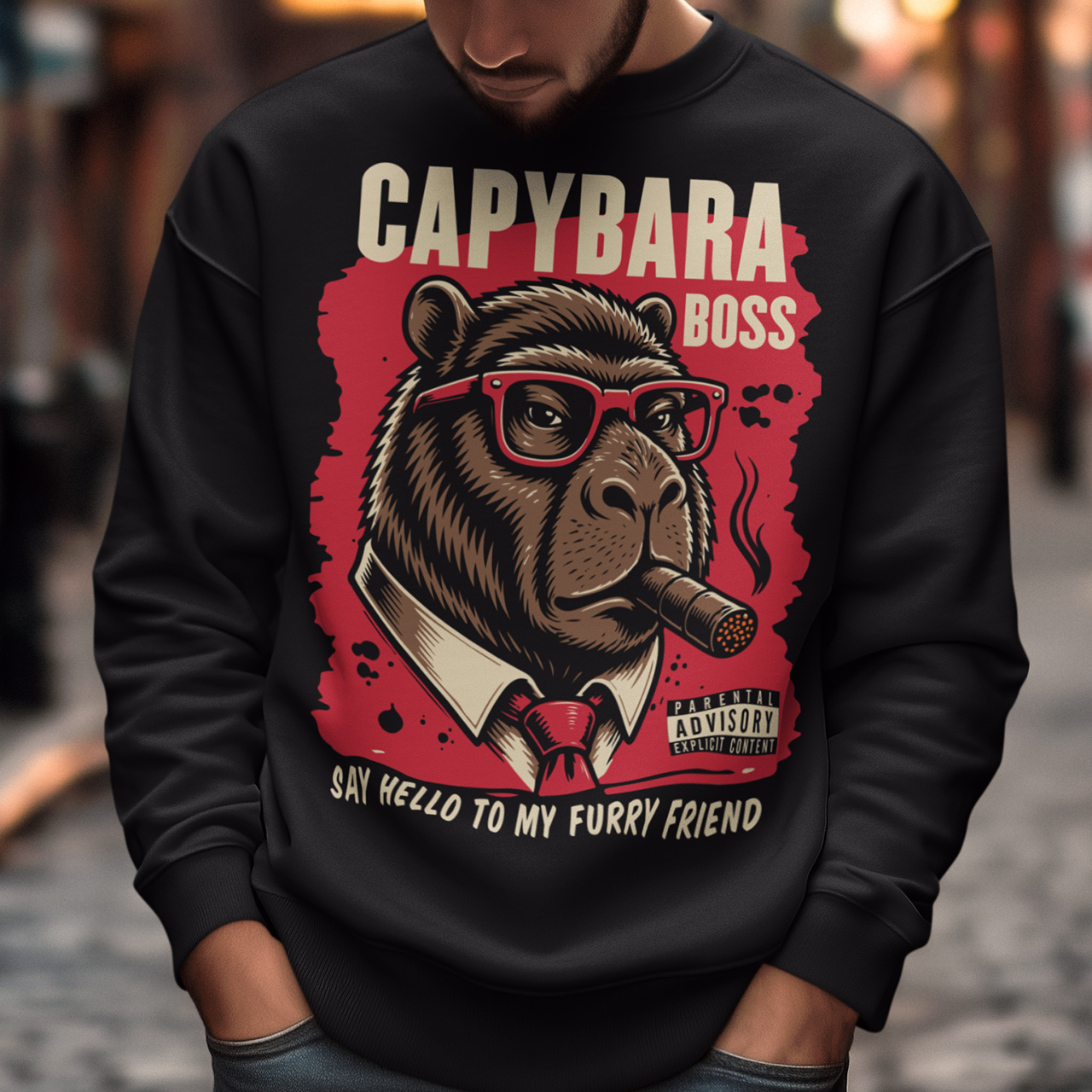 Black sweatshirt featuring a bold vintage-style capybara graphic wearing red sunglasses, a suit and tie, and smoking a cigar. The design includes “CAPYBARA BOSS” text, a red background, and the phrase “SAY HELLO TO MY FURRY FRIEND,” creating a funny gangster-inspired animal design for capybara lovers and meme fans.